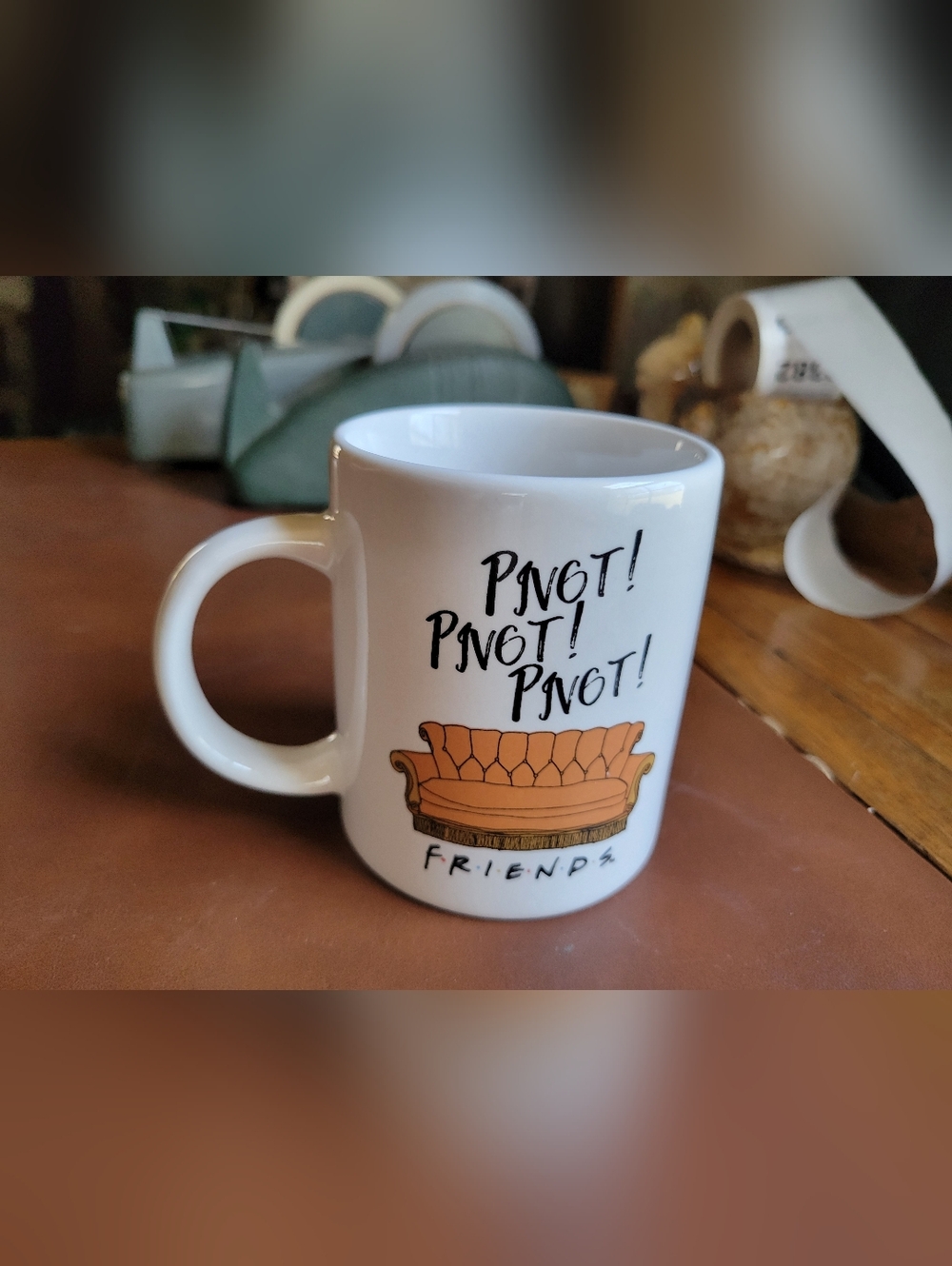 Friends Pivot! Orange Couch Ceramic Coffee Mug